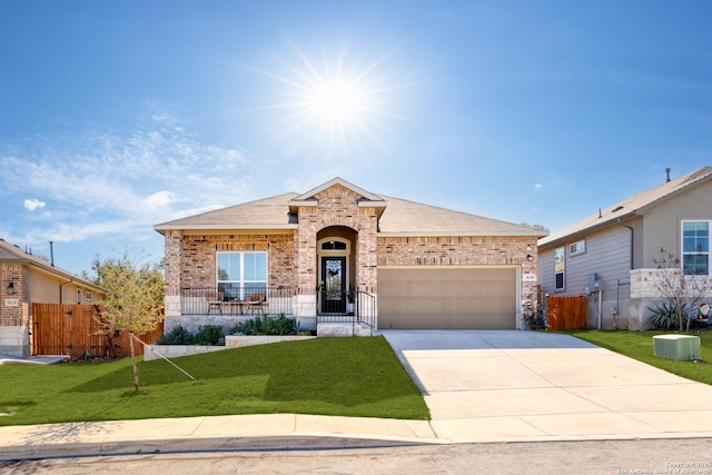 ranch-style house featuring cooling unit, a front lawn, and a garage