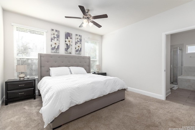 carpeted bedroom with connected bathroom and ceiling fan