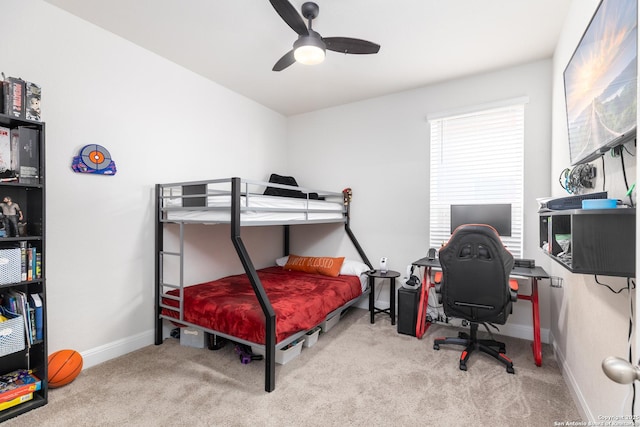 bedroom with ceiling fan and light carpet