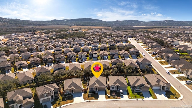 birds eye view of property featuring a mountain view