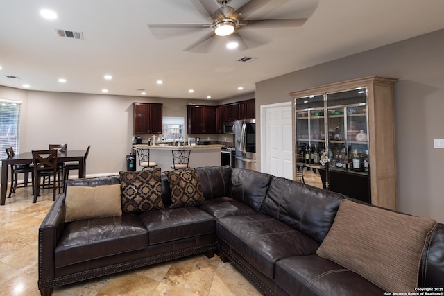 living room with ceiling fan