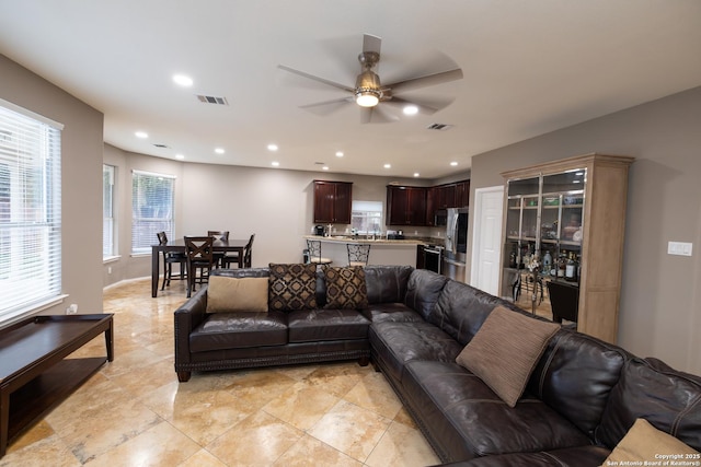 living room with ceiling fan