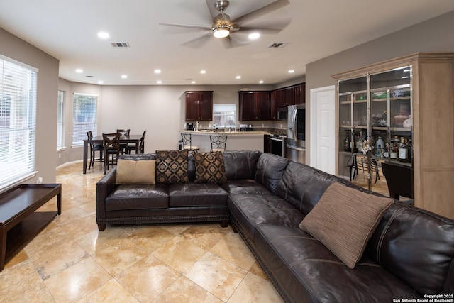 living room featuring ceiling fan