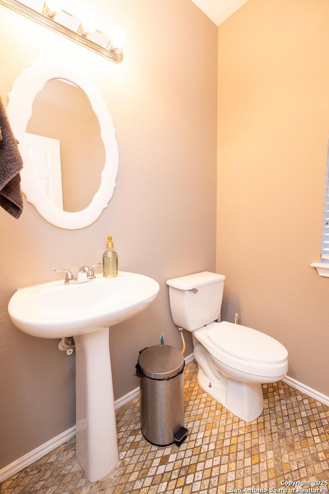 bathroom with sink and toilet