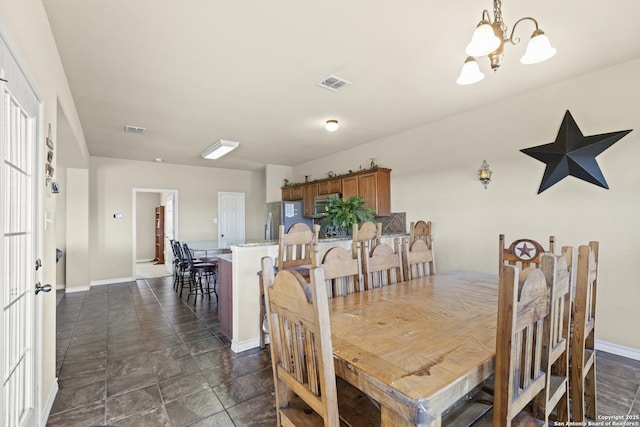 dining room with a chandelier