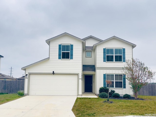 view of front of house with a garage and a front lawn