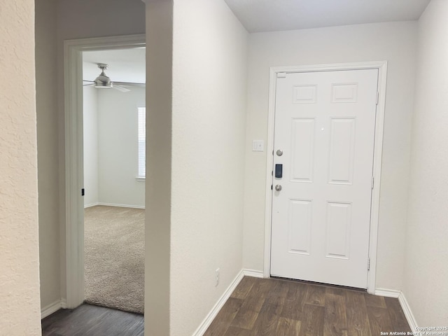 interior space featuring ceiling fan and dark wood-type flooring