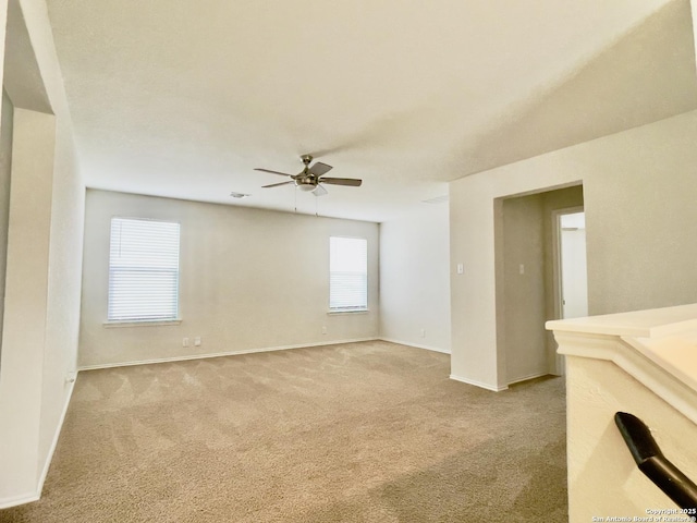 carpeted empty room with ceiling fan