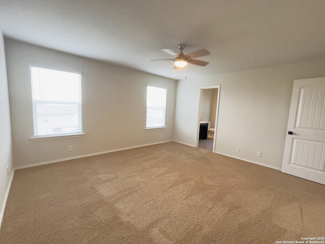 carpeted empty room with ceiling fan