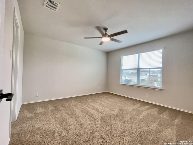 empty room featuring ceiling fan and carpet floors