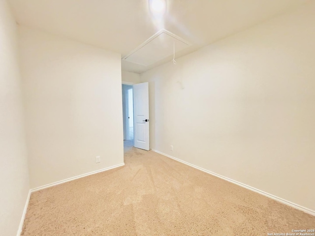 unfurnished room with light colored carpet