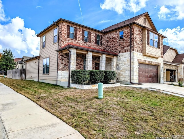 view of front of home featuring a garage and a front lawn