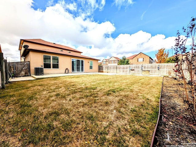 view of yard featuring central AC and a patio area