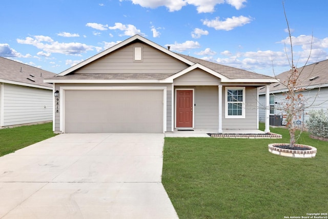 view of front of property with a garage and a front lawn