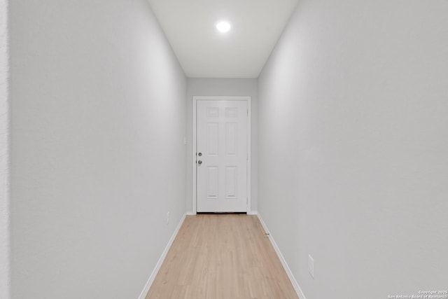 hallway with light wood-type flooring