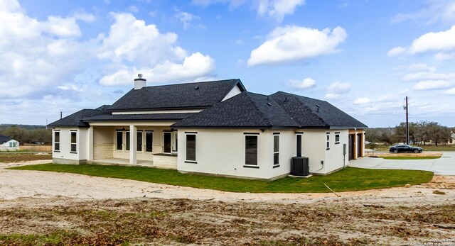 back of property featuring central air condition unit