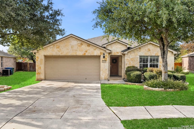 ranch-style house with central AC, a front lawn, and a garage