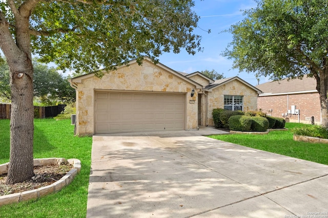 ranch-style home with a front lawn and a garage