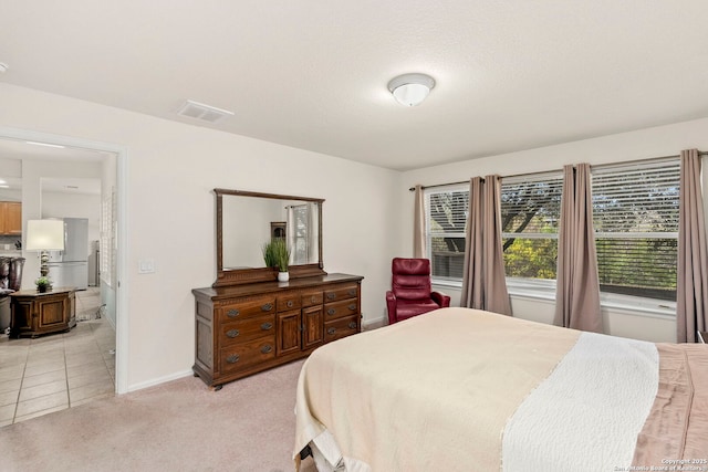 bedroom featuring light carpet