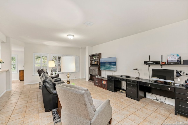 living room with light tile patterned flooring