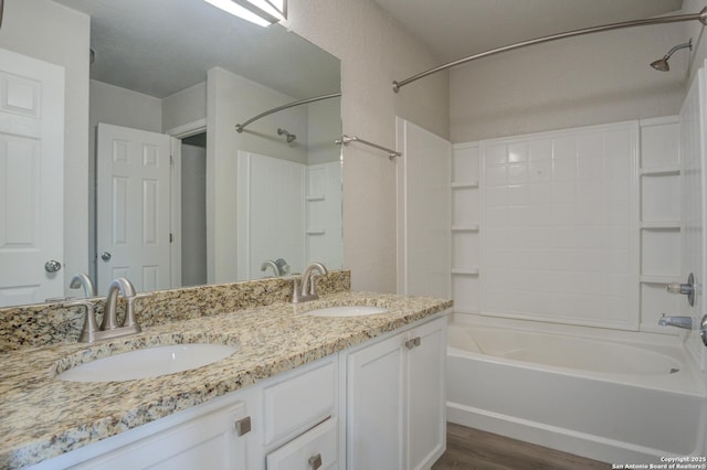 bathroom featuring shower / tub combination, vanity, and hardwood / wood-style flooring