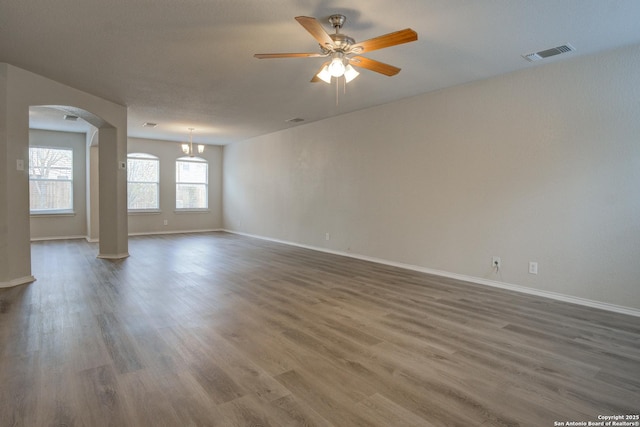 unfurnished room featuring dark hardwood / wood-style floors and ceiling fan