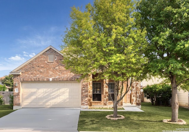 view of front of property featuring a front yard and a garage