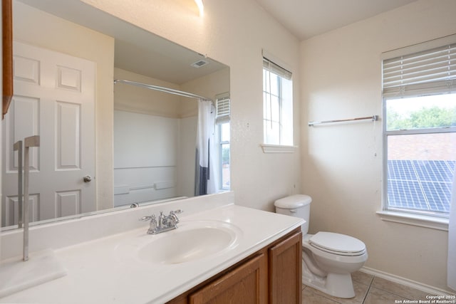 bathroom featuring tile patterned floors, vanity, a shower with shower curtain, and toilet