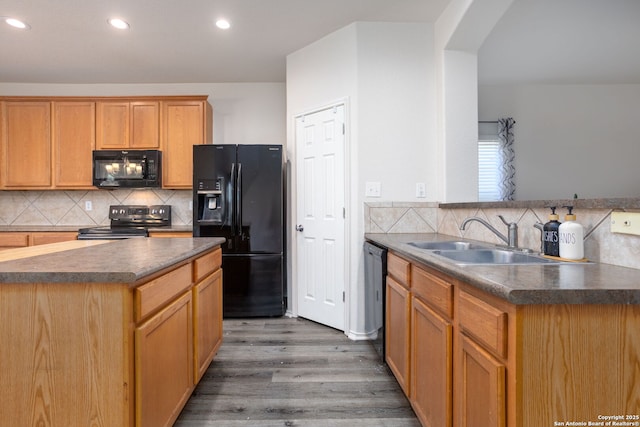 kitchen with backsplash, dark wood-type flooring, sink, and black appliances