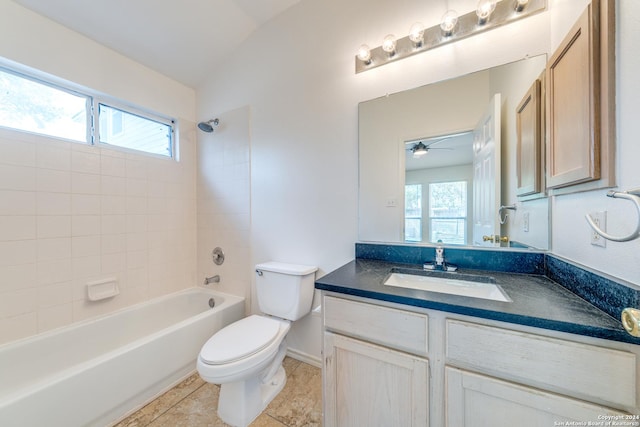 full bathroom with ceiling fan, lofted ceiling, a wealth of natural light, and tiled shower / bath combo