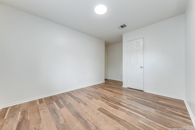 empty room with light wood-type flooring