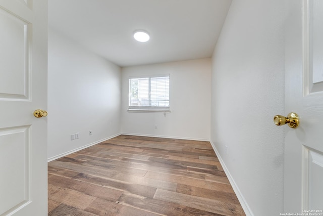 empty room featuring wood-type flooring