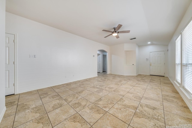 empty room with a wealth of natural light and ceiling fan