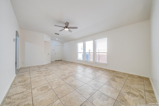 empty room featuring ceiling fan and lofted ceiling