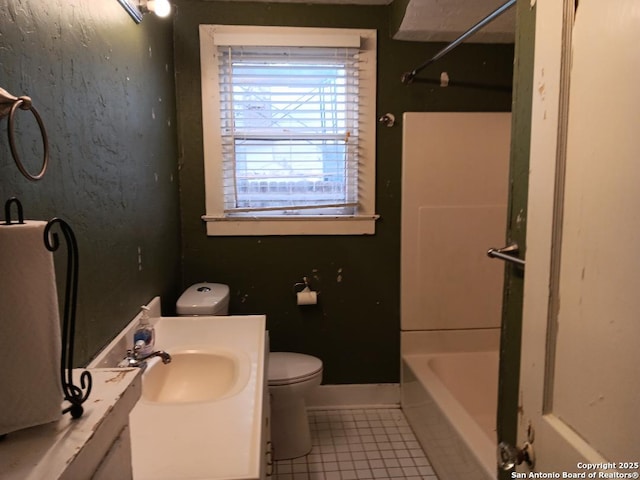 full bathroom featuring tile patterned flooring, vanity, toilet, and washtub / shower combination