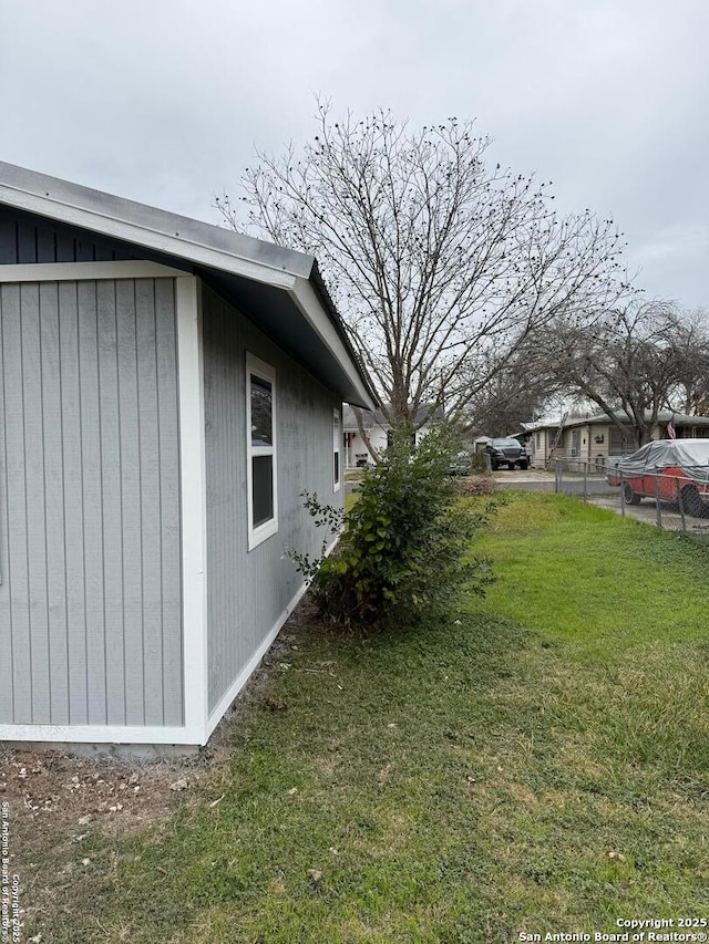 view of home's exterior with a yard