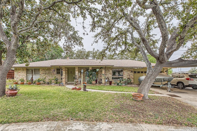 ranch-style house featuring a garage and a front yard