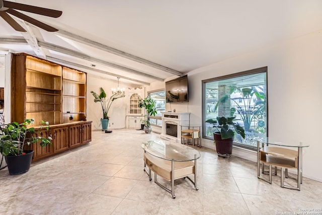 tiled living room featuring ceiling fan with notable chandelier and vaulted ceiling with beams