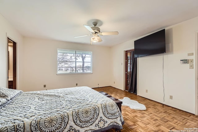 bedroom with ceiling fan and light parquet flooring