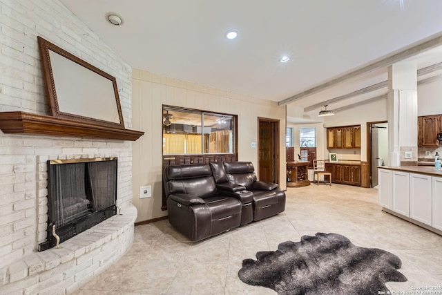 living room with a fireplace and vaulted ceiling with beams