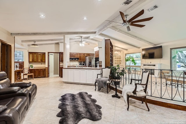 living room featuring lofted ceiling with beams