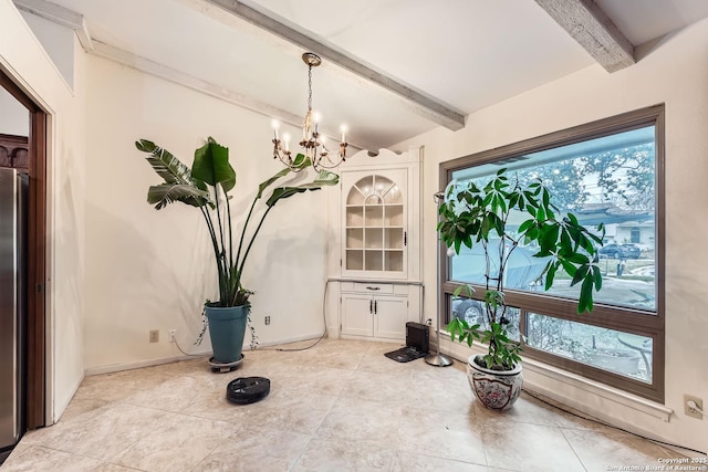 dining space with a notable chandelier, vaulted ceiling with beams, and plenty of natural light