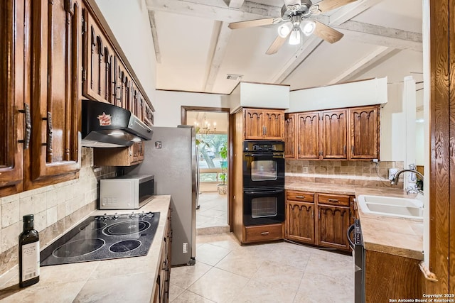 kitchen with extractor fan, black appliances, beam ceiling, and sink