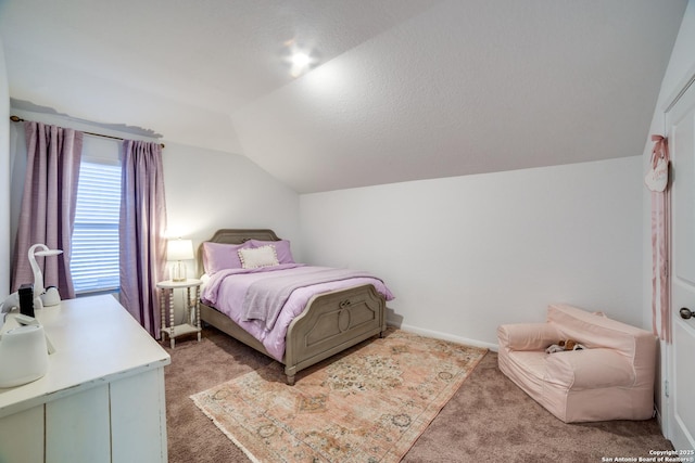 bedroom featuring a textured ceiling, light carpet, and lofted ceiling