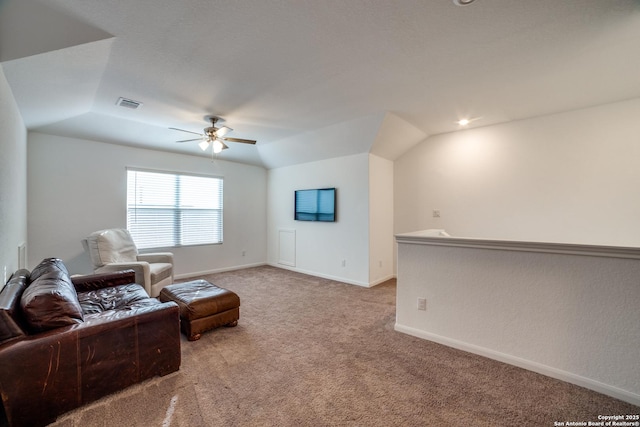 carpeted living room featuring ceiling fan and vaulted ceiling