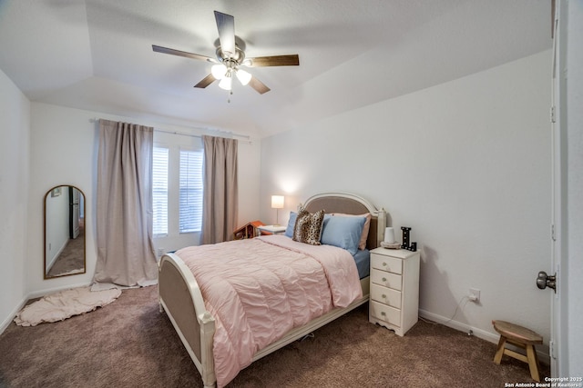 carpeted bedroom with ceiling fan and vaulted ceiling