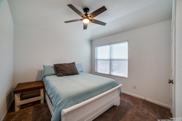 bedroom featuring ceiling fan, lofted ceiling, and dark colored carpet