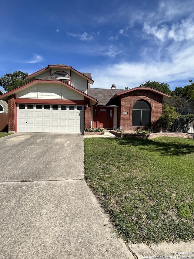 view of front of home with a garage and a front yard