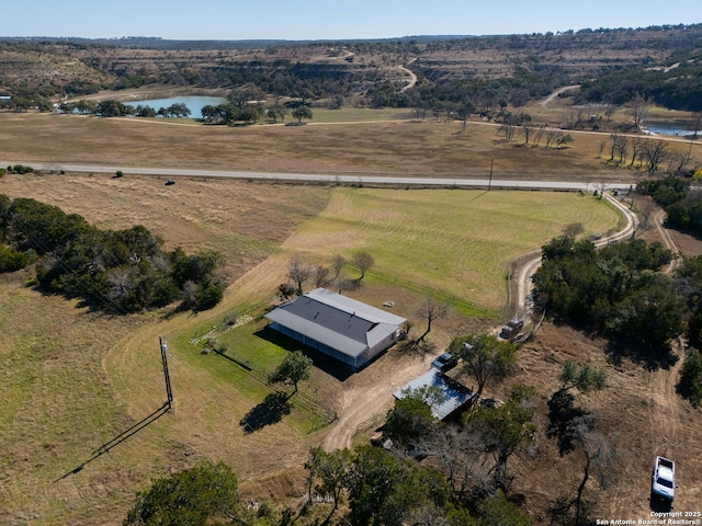 drone / aerial view with a rural view and a water view