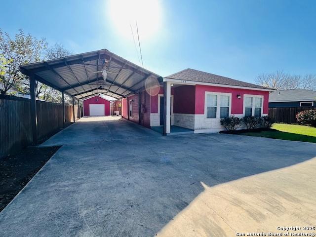 view of front of house featuring a carport and a garage